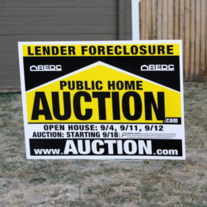 Foreclosure - public home auction sign Photo courtesy photos-public-domain.com 